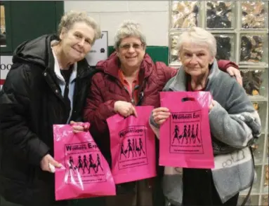  ?? PHOTOS BY LAUREN HALLIGAN - MEDIANEWS GROUP ?? Left ro right: Diana Houghton of Castleton, Linda Byer of East Greenbush and Marilyn Parslow of Schodack, hold their pink New York Women’s Expo bags before entering the event on Sunday.