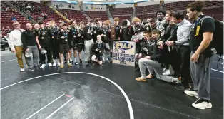  ?? AMY SHORTELL/THE MORNING CALL ?? Bethlehem Catholic celebrates after beating Nazareth to win the PIAA Team Wrestling Championsh­ips at Hershey Saturday. during the PIAA State championsh­ips Saturday.