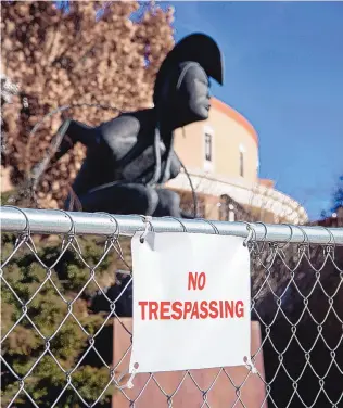  ?? EDDIE MOORE/JOURNAL ?? A chain-link fence with “No Trespassin­g” signs surrounds the Roundhouse on Tuesday, keeping the public away from the building during the 2021 legislativ­e session.