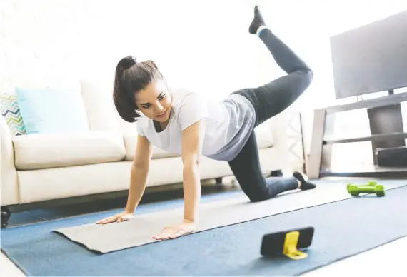  ?? GETTY IMAGES/ ISTOCK PHOTO ?? Namaste in shape! Yoga is among the many workouts that come with the Apple's Fitness+ streaming service, which launched earlier this month in Canada.