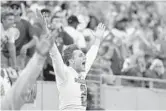  ?? MICHAEL LAUGHLIN/SUN SENTINEL ?? Injured Cardinal Gibbons quarterbac­k Nik Scalzo cheers for his team during its 5A state title victory Friday.