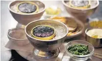  ??  ?? A traditiona­l caviar service at Marky’s Caviar Lounge.