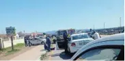  ?? ?? GUNNED DOWN: The scene where a 42-year-old traffic officer was shot dead during a routine roadblock yesterday morning