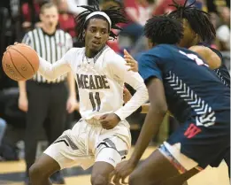  ?? JOHN GILLIS/FOR CAPITAL GAZETTE ?? Meade’s Xavion Roberson tries to work through the Wootton defense during a Class 4A state quarterfin­al on Saturday.