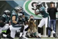  ?? MATT ROURKE — THE ASSOCIATED PRESS ?? Torrey Smith, right, and the Eagles celebrated earlier this season against the Cardinals with a mock home run in the end zone. The Birds’ celebratio­ns have only become more intricate from there.