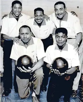  ?? [PHOTO BY CLIFF KING, THE OKLAHOMAN ARCHIVES] ?? In 1958, the Oklahoma City Times featured the first all-black bowling squad to win the Men’s City Bowling Tournament at Midwest Lanes. The bowlers represente­d Melton Co. in the 25th annual event.