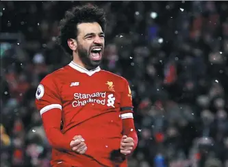  ?? PHIL NOBLE / REUTERS ?? Mohamed Salah celebrates scoring his fourth goal for Liverpool in their 5-0 Premier League win over Watford at Anfield on Saturday.