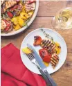  ?? SARAH CROWDER/ASSOCIATED PRESS ?? Grilled lemony chicken and peppers is a quick dinner for a busy weeknight.