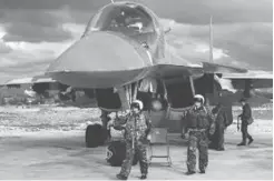 ??  ?? Armée de l’air russe dans la base aérienne de Hmeimim