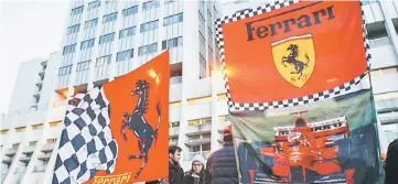  ??  ?? Ferrari flags are seen in front of the CHU Nord hospital emergency unit in Grenoble, French Alps, where retired seven-time Formula One world champion Michael Schumacher is hospitalis­ed after a ski accident, in this December 31, 2013 file photo. — Reuters photo