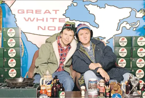  ?? CBC. ?? Bob McKenzie (Rick Moranis), left, and Doug McKenzie (Dave Thomas) have made it clear that the first day of Christmas means beer.