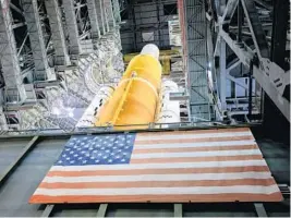  ?? FRANK MICHAUX/NASA ?? In this view looking up inside High Bay 3 of the Vehicle Assembly Building at NASA’s Kennedy Space Center in Florida, the work platforms have been retracted from around the Artemis I Space Launch System on Sept. 20.