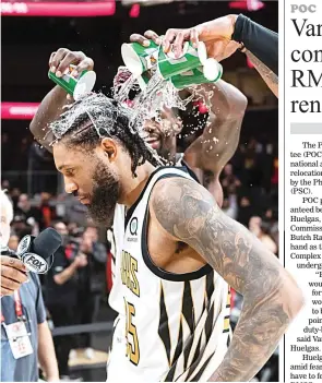  ??  ?? Atlanta Hawks players pour iced-water over the head of forward DeAndre’ Bembry while celebratin­g after the team’s NBA game against the Denver Nuggets Saturday in Atlanta. The Hawks won 106-98. (AP)