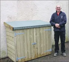  ??  ?? Gavin Mutch of Cladach Sawmill with the store he designed, constructe­d and donated.