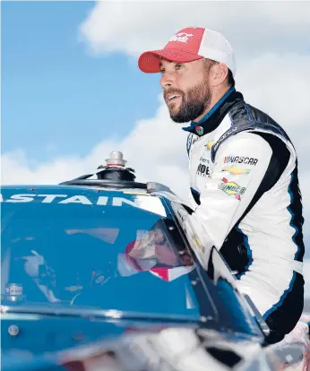  ?? JAMES GILBERT/GETTY ?? Ross Chastain enters his car during qualifying Saturday for the Goodyear 400 in South Carolina.