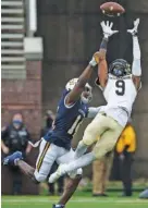  ?? STAFF PHOTO BY TROY STOLT ?? Wofford wide receiver KeiAndre Sanders (9) can’t bring in a long pass while covered by UTC’s Jordan Jones during a SocCon game on Feb. 27 at Finley Stadium.