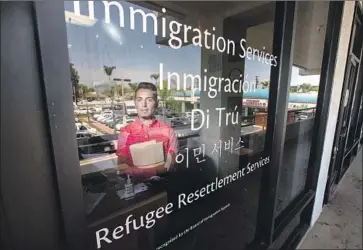  ?? Allen J. Schaben Los Angeles Times ?? JOSE SERRANO outside the nonprofit World Relief in Garden Grove, where he is program manager. “While we closed our refugee resettleme­nt service,” he said, “we did not close our desire to help refugees.”
