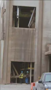  ?? Kevin Myrick/SJ ?? ATF officials inspect damage at JCG Farms Feed Mill in Rockmart on Tuesday, Feb. 9, 2016.