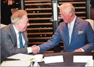  ?? EDDIE MULHOLLAND/POOL PHOTO VIA AP, FILE ?? Britain’s then-Prince Charles meets Andrew Lloyd Webber during a visit to the Royal Albert Hall to discuss the arts and creativity in school, in London on Sept. 5, 2018.