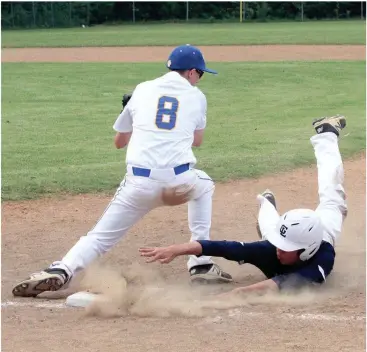  ??  ?? Gordon Lee’s Will Carswell kicks up the dust as he dives back to first to avoid a tag by Ringgold first baseman Austin McMahan in a semifinal game last week at Seabolt Field. The Tigers swept the doublehead­er to win the series and advance to the finals against Heritage. (Messenger photo/Scott Herpst)