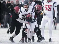  ?? KAYLE NEIS ?? Carter Sombach of the Regina Miller Marauders carries the ball during action in the provincial 4A high school football final on Saturday at SMF Field. Miller beat the Saskatoon Centennial Chargers 45-0.