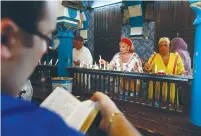  ?? (Anis Mili/Reuters) ?? JEWS LIGHT CANDLES inside the El Ghriba synagogue on Djerba island in Tunisia on April 28, 2013, Lag Ba’omer 5773.