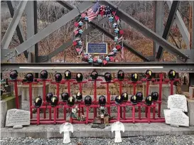  ?? John Raby / Associated Press ?? A memorial to 29 miners killed in an April 2010 explosion is at the entrance to the Upper Big Branch mine in Montcoal, W.Va.