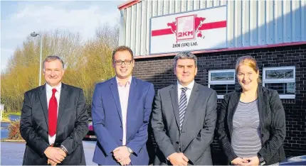  ??  ?? >
From left: Rob McLaren of 2KM, Richard Griffiths of Higgs & Sons, John Dillon of GJS Dillon and Lucy Allcoat of NatWest outside engineerin­g firm 2KM’s base at Unit 1 Buntsford Park Road in Bromsgrove