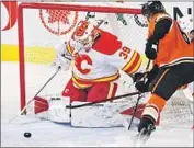  ?? Larry MacDougal Associated Press ?? RICKARD RAKELL of the Ducks can’t get the puck past Calgary’s Cam Talbot in the third period.