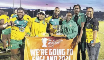  ?? (Photo: Observer file) ?? Members of the national rugby team pose with their Americas Championsh­ip trophy after beating longtime rivals, the United States 16-10 in Jacksonvil­le, Florida to qualify for the 2021 Rugby League World Cup in England, recently.