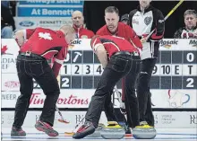  ?? ANDREW VAUGHAN
THE CANADIAN PRESS ?? Ontario skip John Epping, right, watches as Team Canada third Mark Nichols, skip Brad Gushue and lead Geoff Walker, left to right, move a rock in the eight-team championsh­ip round at the Tim Hortons Brier at the Brandt Centre in Regina in March.