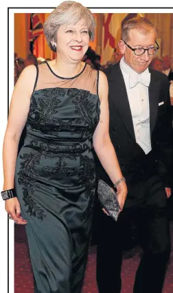  ??  ?? Theresa May and husband Philip at the banquet last night