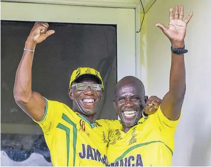  ?? (Photo: CWI Media) ?? Jamaica’s Head Coach Terrence Corke (left) and Team Manager Gibbs Williams celebrate the Under-19s triumph in the 2023 regional cricket tournament.