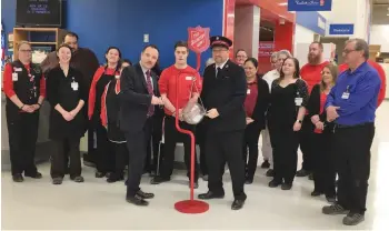  ??  ?? Mayor Fraser Tolmie, Major Dan Broome, volunteers and Superstore employees kick off the 2018 Kettle Campaign.