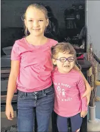  ?? CONTRIBUTE­D ?? Norah Cameron-Ranni, left, and her older sister Alyssa Cameron were dressed for Pink Shirt Day on Sept. 13. When Norah has to travel with their parents to Toronto for medical appointmen­ts, Alyssa stays home with family.