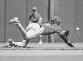  ?? ROBERT EDWARDS USA TODAY Sports ?? Cincinnati Reds infielder Elly De La Cruz dives for a ground ball against the San Francisco Giants during the fourth inning Sunday in San Francisco.