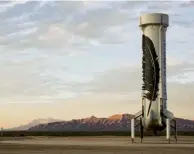  ??  ?? The reusable rocket booster, safely back at the launch site – a triumph for Bezos