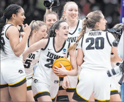 ?? Caean Couto The Associated Press ?? Iowa guard Caitlin Clark, with ball, is the first woman or man to post a triple-double in the NCAA Tournament that included a 40-point effort.