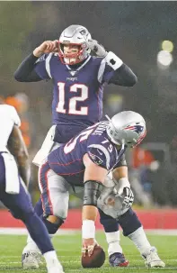  ?? MARGARET BOWLES/ASSOCIATED PRESS ?? Patriots quarterbac­k Tom Brady audibles at the line of scrimmage during a wild-card playoff game against the Titans on Jan. 4 in Foxborough, Mass. The Titans won 20-13.