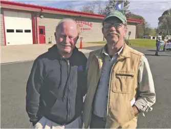  ?? PHOTOS BY JOHN MCCASLIN ?? Jackson district write-in candidate Ron Makela (right) meets with county voter Tom McConn outside the Amissville polling station.