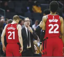  ?? Associated Press ?? NO HOME
In this Jan. 8 file photo, Toronto Raptors coach Nick Nurse, center, gathers his team during a timeout against the Charlotte Hornets. The Raptors have an NBA championsh­ip to defend and a very long stay at the Disney complex awaiting them.