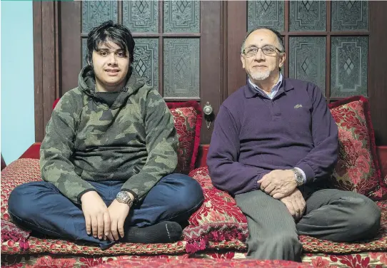  ?? FRANCIS VACHON ?? “It’s not all of society that is racist and Islamophob­ic,” said mosque co-founder Boufeldja Benabdalla­h with his son, Sami. “Just a very small portion. But that small portion makes a lot more noise than the silent majority that is kind, that is good,...