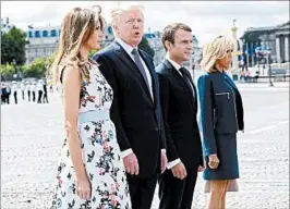  ?? CHRISTOPHE ARCHAMBAUL­T/GETTY-AFP ?? French President Emmanuel Macron, second from right, and wife, Brigitte Macron, stand with President Donald Trump and Melania Trump after the Bastille Day military parade.