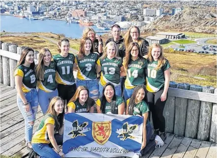  ?? BRITTANY BURNIE PHOTOS ?? The senior girls volleyball team and coaches pose for a picture at the top of Signal Hill during their October trip.