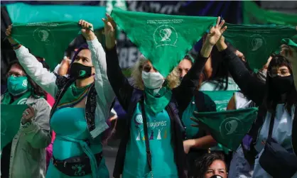  ??  ?? Activists hold green handkerchi­efs, a symbol of the pro-abortion movement, during a demonstrat­ion in Buenos Aires. Photograph: Agustin Marcarian/Reuters