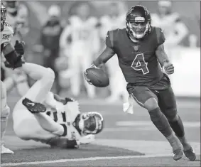  ??  ?? Gary Landers / The Associated Press
Houston quarterbac­k Deshaun Watson (4) runs for a touchdown during the first half of Thursday’s game against the Bengals in Cincinnati. The Texans won 13-9.