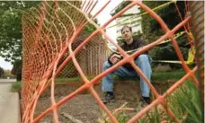  ?? PETER POWER/THE CANADIAN PRESS ?? Richard Massie stands next to the hole in the ground where a Canada Post community mailbox was supposed to go in Hamilton.