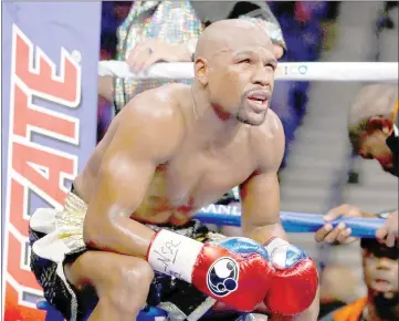  ??  ?? Floyd Mayweather Jr sits in his corner between rounds against Manny Pacquiao during their welterweig­ht unificatio­n championsh­ip bout at MGM Grand Garden Arena in Las Vegas, Nevada in this on May 2, 2015 file photo. — AFP photo