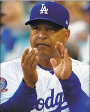  ?? Luis Sinco Los Angeles Times ?? DAVE ROBERTS got a new deal after leading the Dodgers to consecutiv­e World Series appearance­s.
