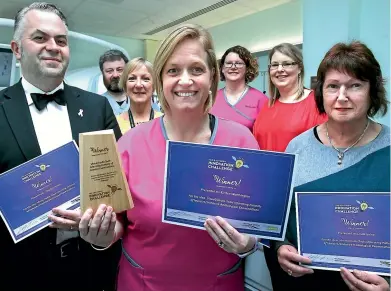  ??  ?? Southland Hospital’s senior radiology staff display the certificat­es they received for a winning entry in the Southern District Health Board Awards in Invercargi­ll yesterday, front row, Stephen Jenkins, Kirsten Worthingto­n, Linda Irvine; middle row, Lynda McCutcheno­n; back row, Andrew Baird, Jill McConachie, Debbie Fahey. KAVINDA HERATH/STUFF